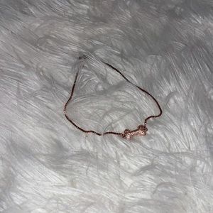 NWOT rose gold adjustable bone charm bracelet.